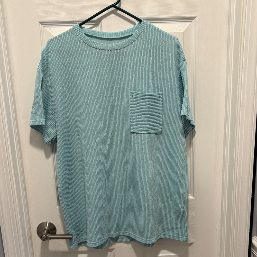 Raised ribbed knit top with pocket, Size medium 
Bought from Discount Diva
